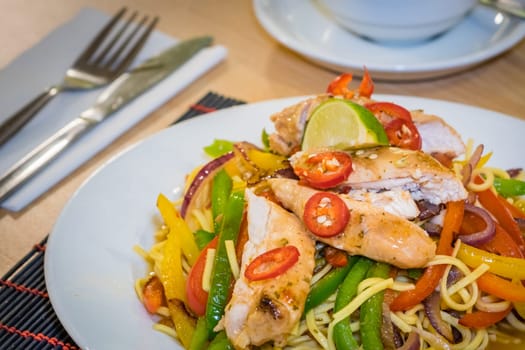 Oriental grilled chicken meal vegetables and noodles