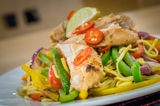 Oriental grilled chicken meal vegetables and noodles