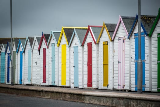 Row of colourful beach huts in Paignton, Devon, England