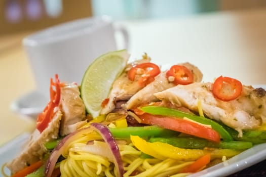 Oriental grilled chicken meal vegetables and noodles