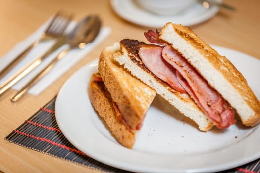 Toasted bread with bacon served for breakfast