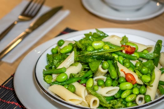 Close-up of freshly made green vegetables penne pasta