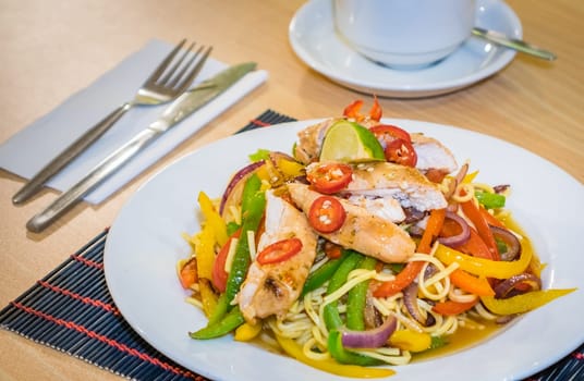 Oriental grilled chicken meal vegetables and noodles