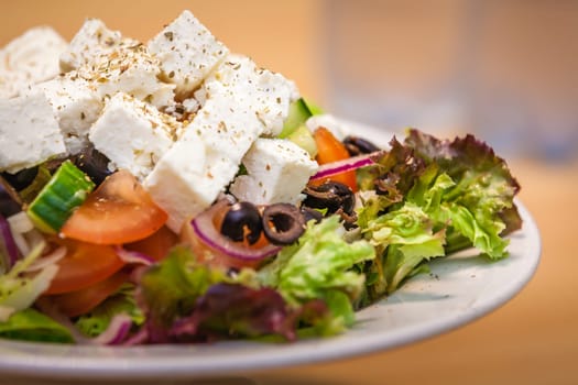 Summer Greek salad with olives, tomatoes, cucumber and feta cheese