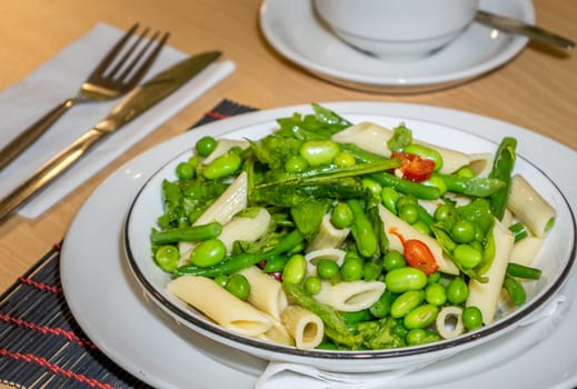 Close-up of freshly made green vegetables penne pasta