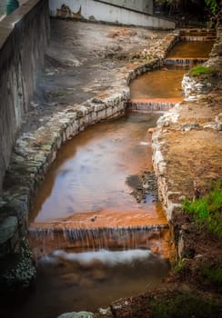 Stream with geothermal hot mineral water in Furnas, Sao Miguel, Azores, Portugal