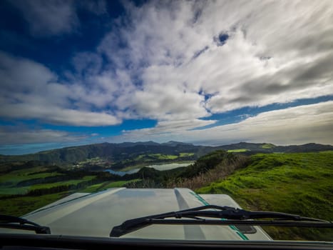 View through the front window of a jeep towards the Furnas Lake, Sao Miguel island, Azores, Portugal