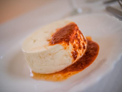 Queijo Fresco - a unique and delicious speciality of the Azores - cheese served with slightly spicy sauce based on tomatoes and chili