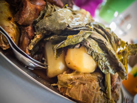 Traditional Furnas stew which is cooked for many hours in the volcanic vents in the ground. It consists of various meats - chicken, beef, pork, chorizo, lamb as well as potatoes and cabbage