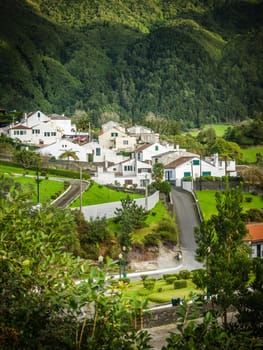 White homes in Furnas town, which lies in the volacano crater, Sao Miguel, Azores, Portugal