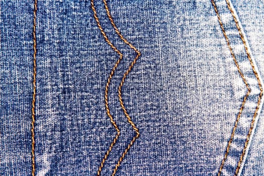 Blue jeans texture background and orange seam