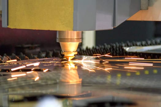 CNC laser cut machine while cutting the sheet metalCNC laser cut machine while cutting the sheet metal