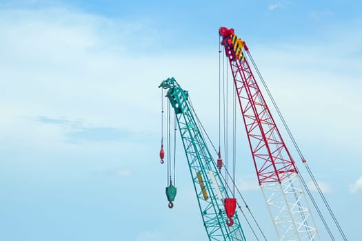 Crane lift green and red In the blue sky