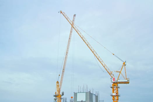 Building site with cranes and blue sky