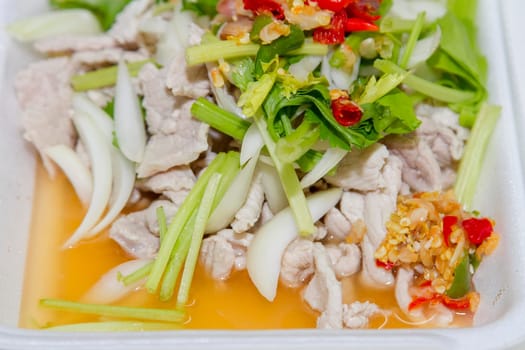 Thai food, lemon pork in white foam box