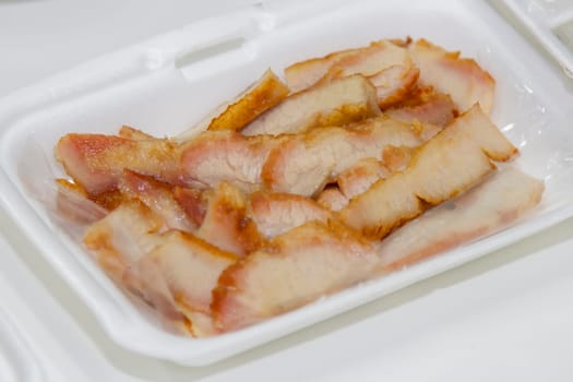 Thai food, roasted pork neck in foam box