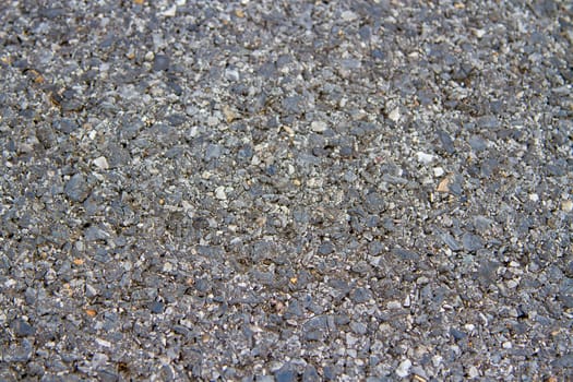 The road is black granite in the daytime.