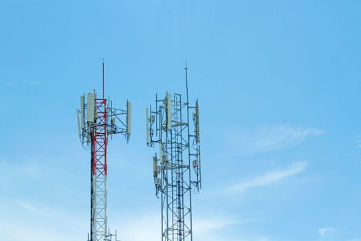 Mobile phone communication two tower transmission  signal with blue sky background