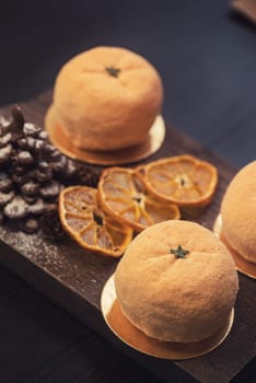 Tasty dessert as orange fruit with chocolate fir-tree for new year holiday