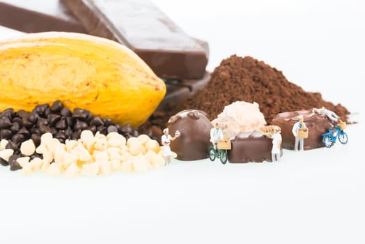 Miniature chefs and chocolate truffles close up