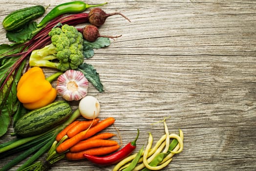 Various of fresh vegetables and ingredients on wooden rustic background