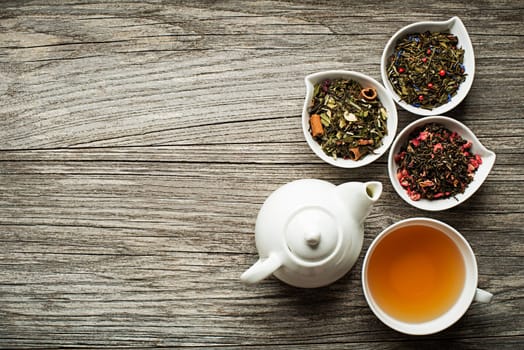 Cup of tea with dry tea collection of different types