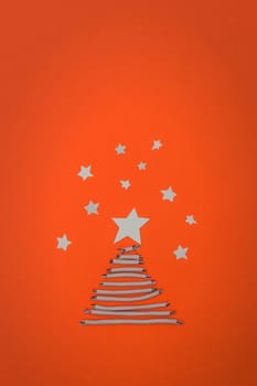 Tech New Year: fir-tree from wires on orange background