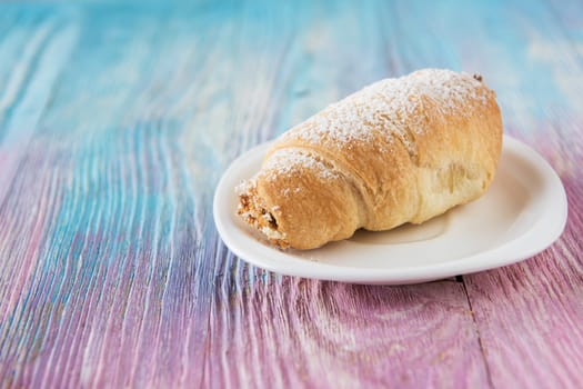 Tasty eclair on a color gradient background