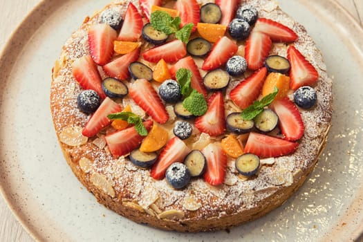 Sweet bright cakes with fruit and berries