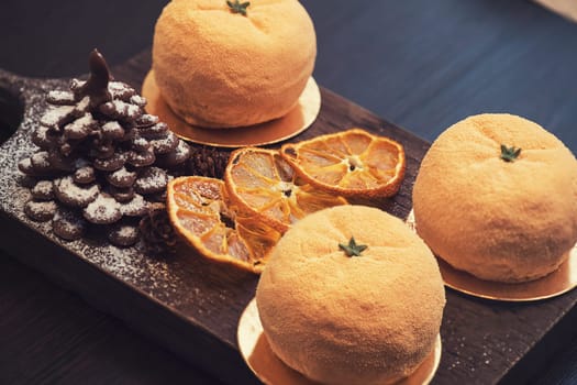 Tasty dessert as orange fruit with chocolate fir-tree