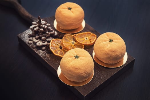 Tasty dessert as orange fruit with chocolate fir-tree