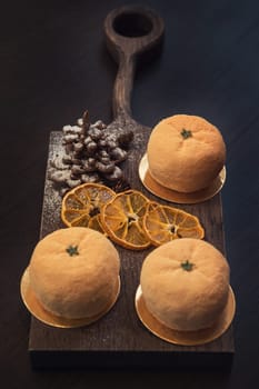 Tasty dessert as orange fruit with chocolate fir-tree
