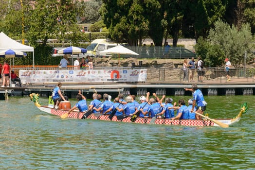 Rome, Italy - July 30, 2016: Dragon boat crews  compete at the european championships held in Italy in 2016 summer, Italian crew after the race