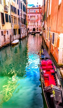 Small Canal Bridge Buildings Red Fancy Gondola Boats Reflections Venice Italy
