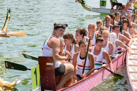Rome, Italy - July 30, 2016: Dragon boat crews  compete at the european championships held in Italy in 2016 summer, in the photo a girl of the Hungary  crew is smiling after race