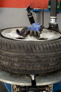 A tire on a fixing machine ready to be fixed