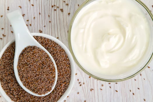 Indian psyllium seeds in detail with natural yogurt