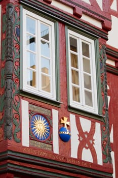 Renovated historic half-timbered building with window in detail