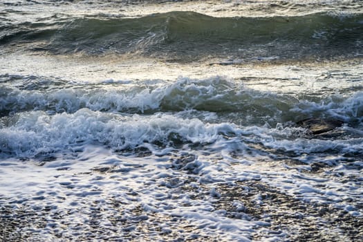 waves of foam spray in the ocean