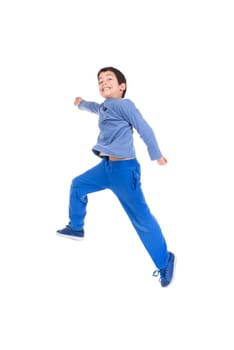 Young boy jumping isolated in white