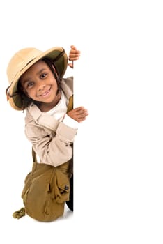 Young girl with Safari clothes behind a white board isolated in white