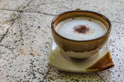 Close up cappuccino coffee on marble table
