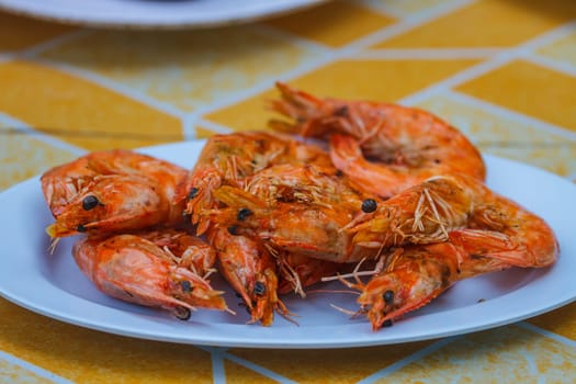 Grilled prawns on plate, delicious prawns on thw table