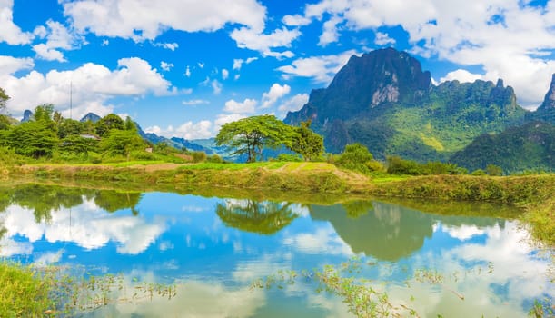 Beautiful landscape, pond on the foreground. Vang Vieng, Laos.