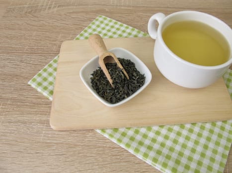 A cup of Chun Mee green tea from China