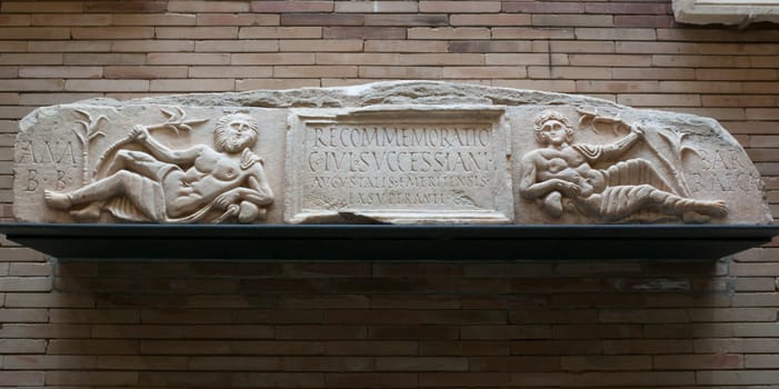 Merida, Spain - December 20th, 2017: The rivers lintel. Roman relief representing the two rivers of Emerita Augusta. National Museum of Roman Art in Merida, Spain