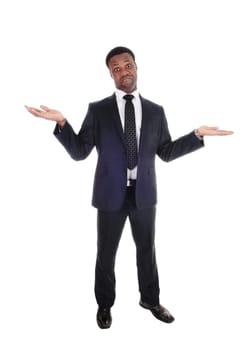 A handsome tall African American man standing in a suit with .outchteched hands is not sure, isolated for white background.