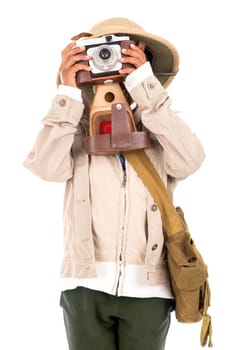 Young boy with a camera playing Safari isolated in white