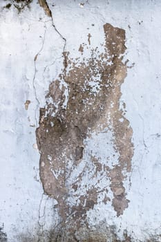 Cracking and peeling paint on a concrete wall. Perfect background with space.