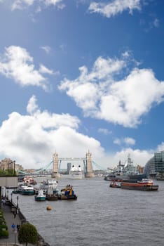 cruise liner departing london under tower bridge